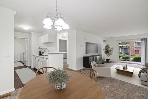 A modern living room with a wooden table and a television.