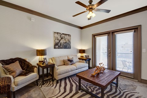 A living room with a zebra rug on the floor.