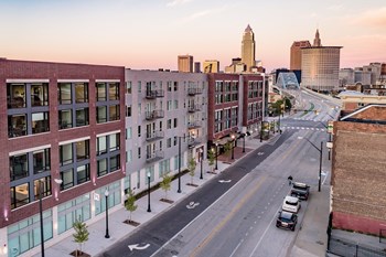 View of exterior of Quarter apartment building, Detroit avenue and downtown Cleveland at sunset - Photo Gallery 18