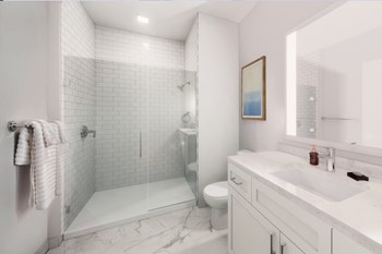 Quarter Phase II baths feature a glass shower enclosure and subway tile - Photo Gallery 5