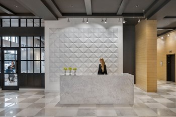 Marble desk with receptionist in Quarter lobby - Photo Gallery 4