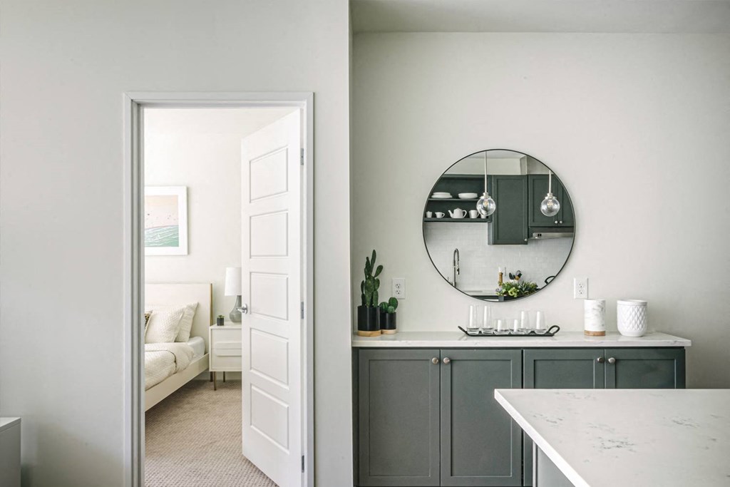 Kitchen with side console with round mirror