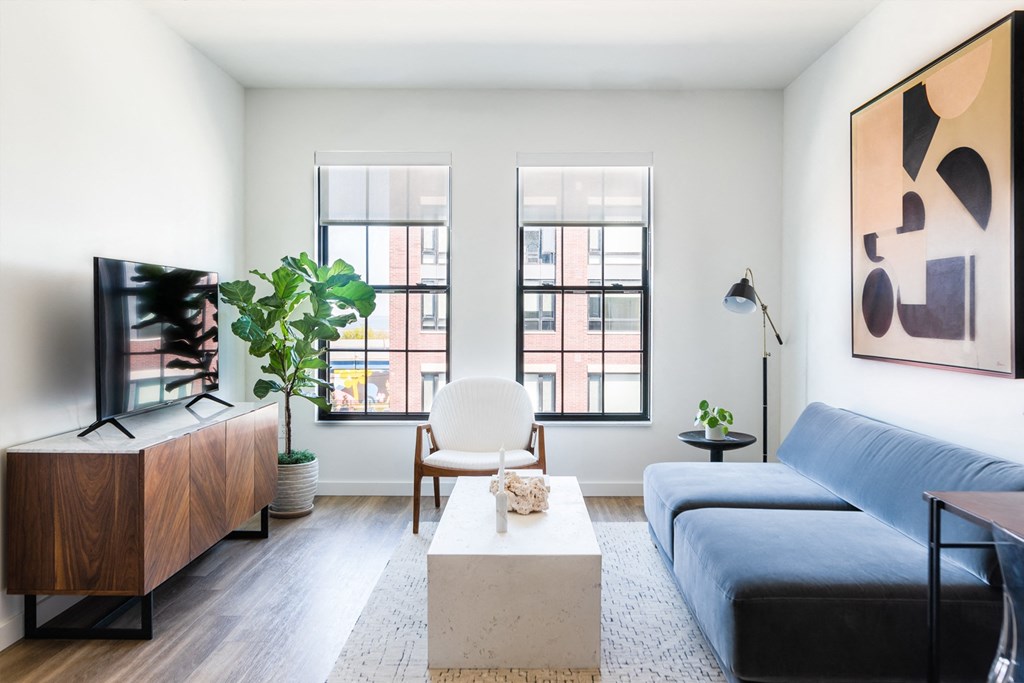 Living room with modern furniture and view of Quarter phase 1
