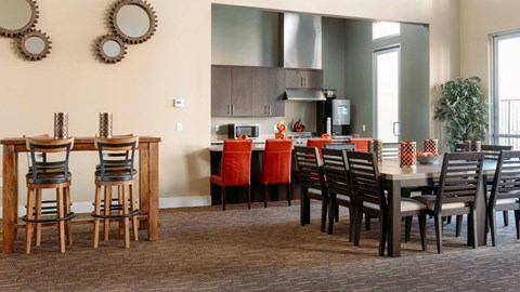 A dining room with a table set for six.