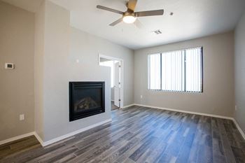 an empty living room with a fireplace at Ascent North Scottsdale Apartments, Phoenix, AZ