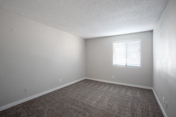 an empty bedroom with a window at Ascent on Pantano Apartments, Arizona, 85710