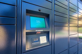 a bank teller machine with a screen that says hub at Ascent on Peoria Apartments, Phoenix, 85029