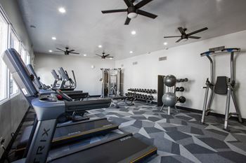 a large fitness room with treadmills and other exercise equipment at Ascent on Pantano Apartments, Tucson, 85710