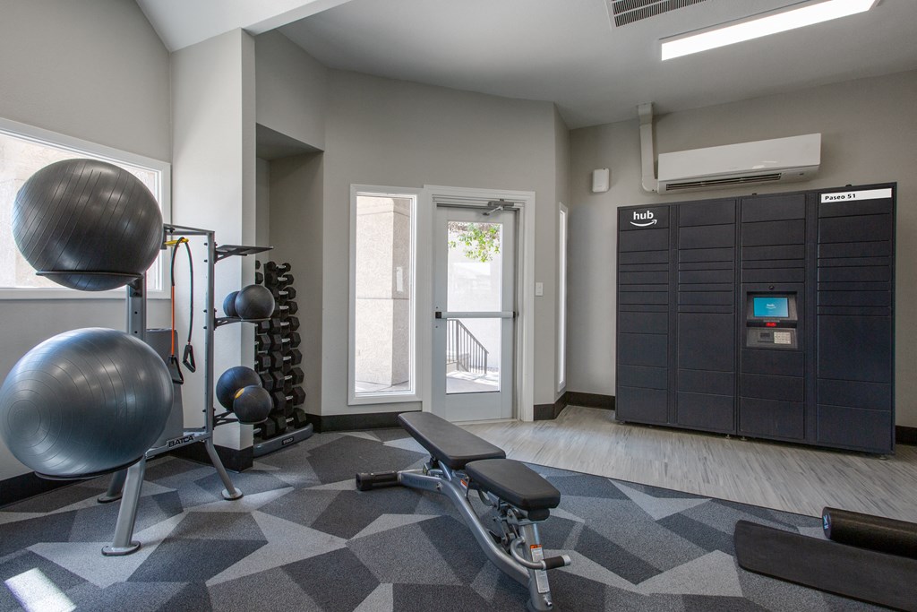 a gym with a punching bag and other exercise equipment