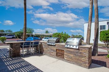 our apartments have an outdoor kitchen with a grill and bbq at Ascent on Pantano Apartments, Tucson