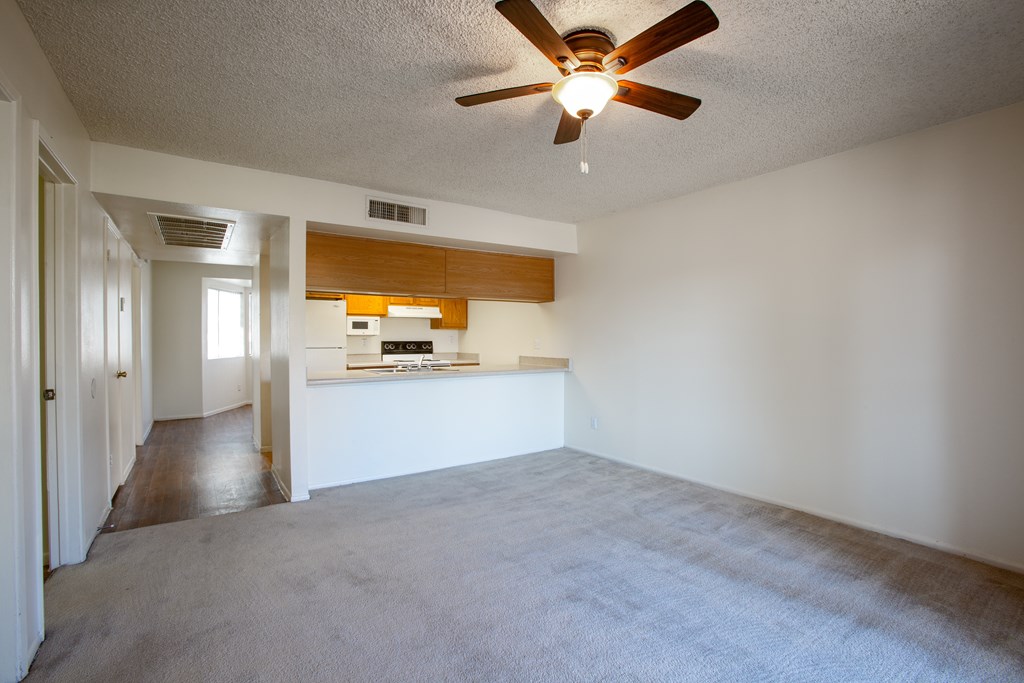 A room with a ceiling fan and a carpeted floor.at Ascent on Spence, Arizona, 85281