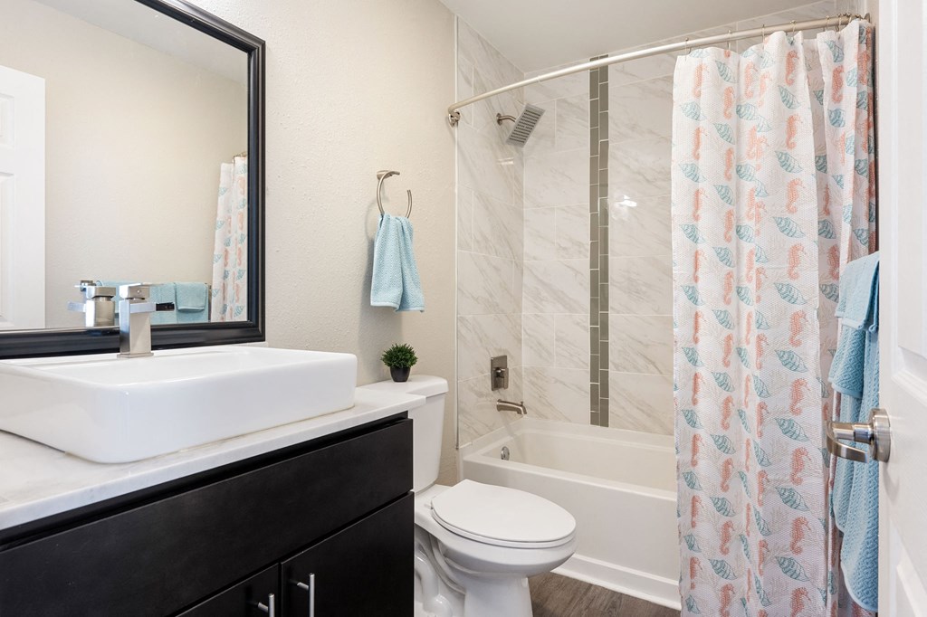 a modern bathroom with a white sink bowl at Nextloft Apartments, Bluffton, South Carolina