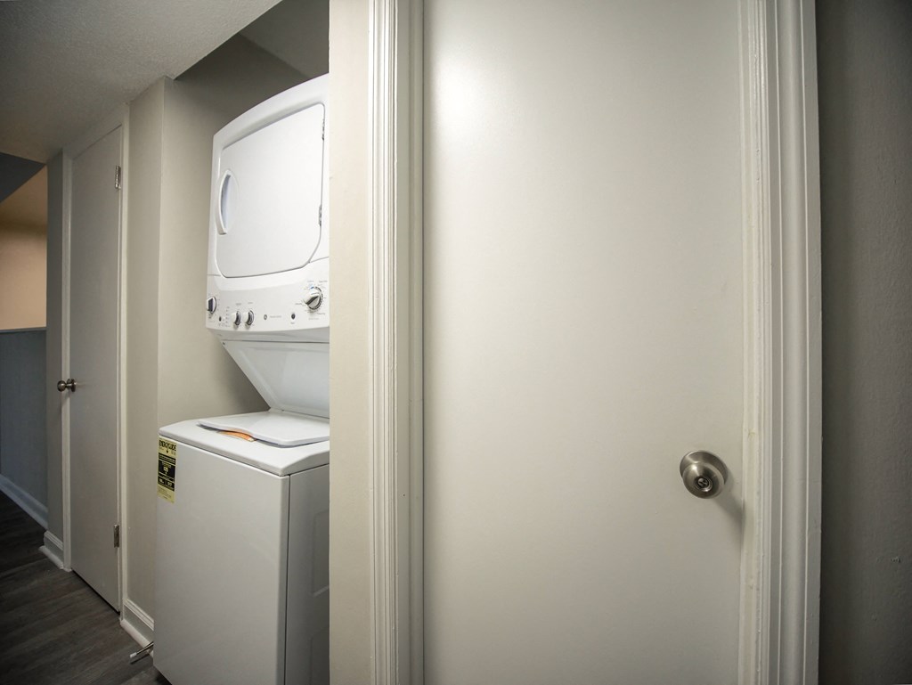 a washer and dryer in a room with a door