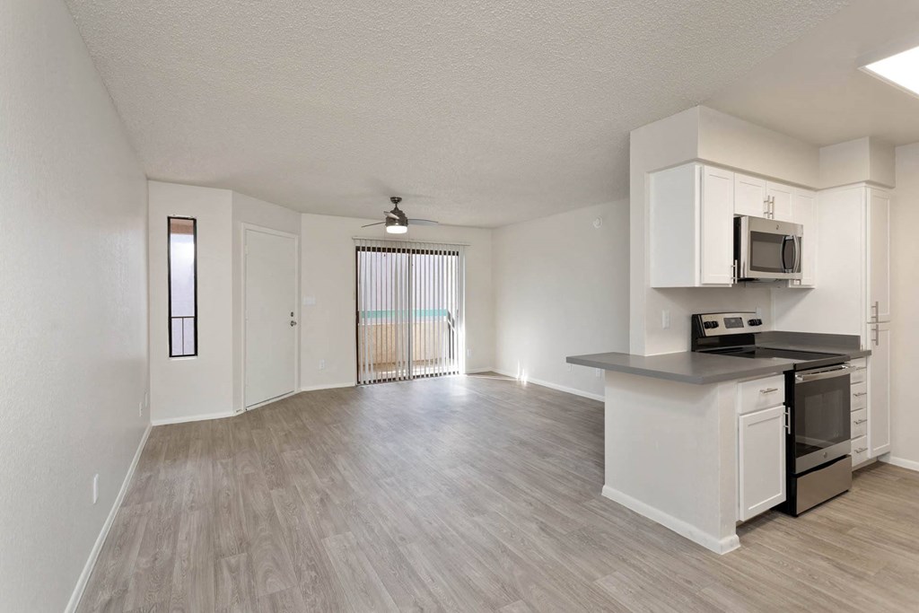 apartment living room with view of balcony at Paseo 51, Glendale, Arizona