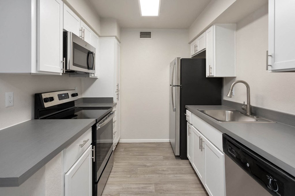 apartment kitchen with stainless steel appliances at Paseo 51, Glendale, 85302