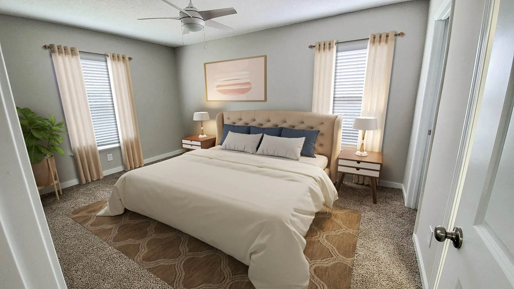 Apartment Bedroom a bedroom with a bed and two windows at Planters Trace, Charleston, SC