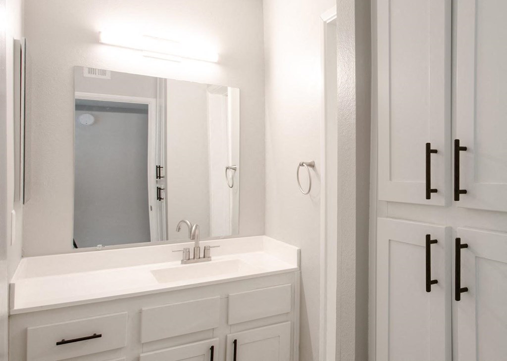 a bathroom with a sink and a mirror at Ascent on Peoria Apartments, Phoenix, 85029