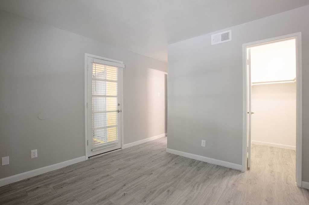 a bedroom with hardwood floors and grey walls at Ascent on Peoria Apartments, Arizona, 85029