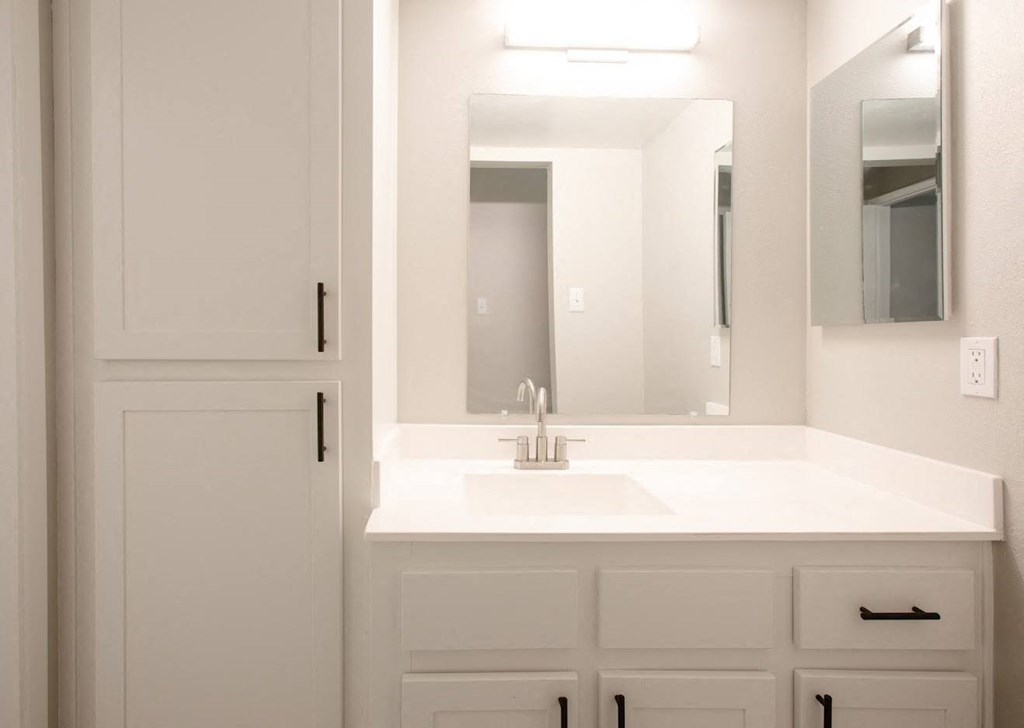 a bathroom with a sink and a mirror  at Ascent on Peoria Apartments, Phoenix, AZ 85029