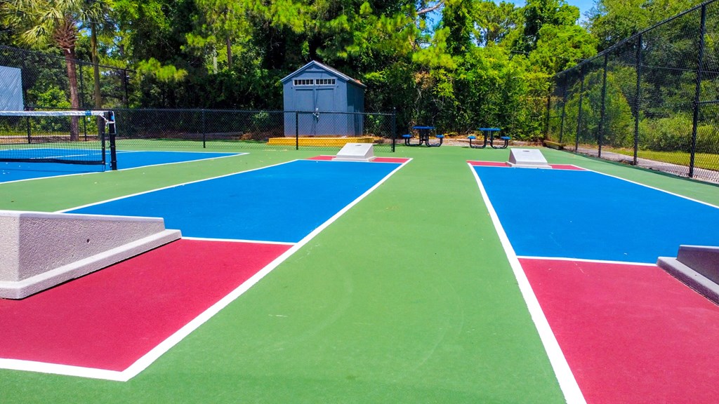the tennis courts are painted with different colors