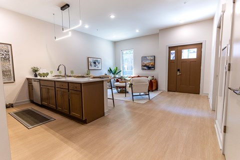 A kitchen with wooden cabinets and a sink.