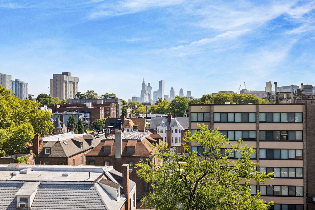 the view of the city from the roof of a building