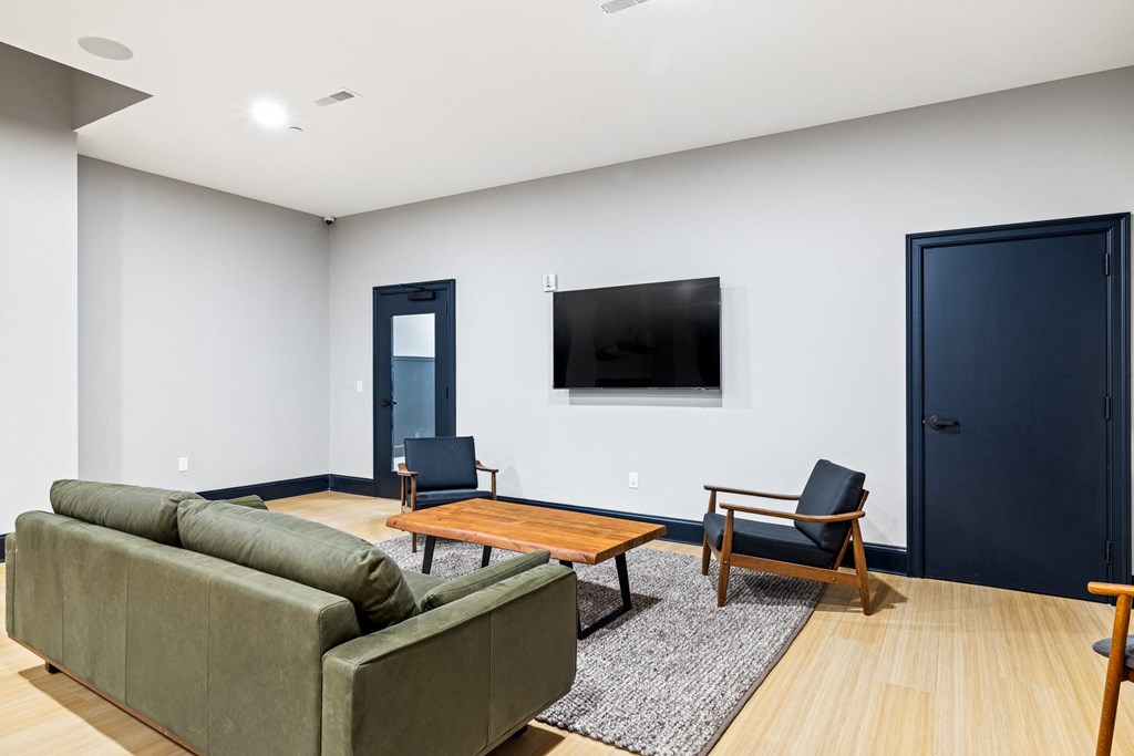 a living room with a couch and a table and a television