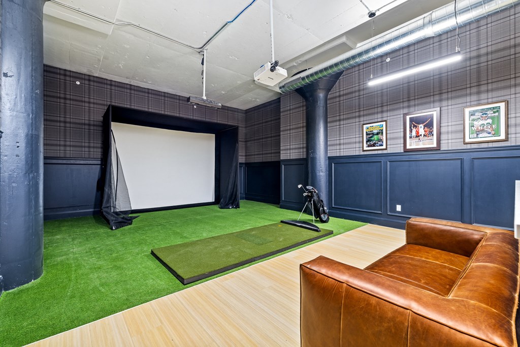 a large room with a couch and a projector