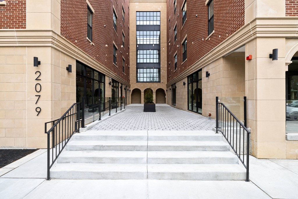 the entrance to a building with stairs in front of it