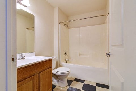 A White Bathroom with a Bathtub at Ridgecrest Apartments, Bristol, VA, 24201