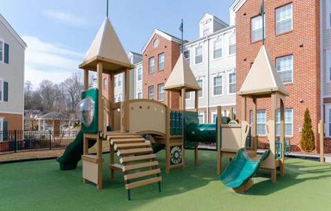 a playground with a slide and a tower