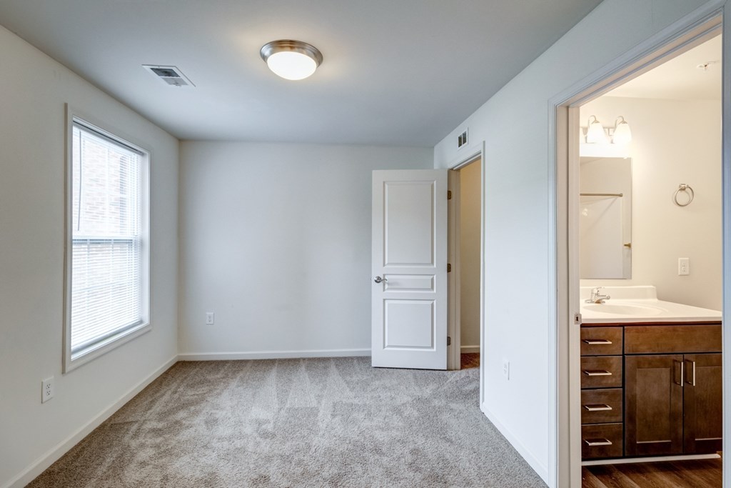 A white door is in the middle of a room. at Ada Park Apartments, Virginia, 23601