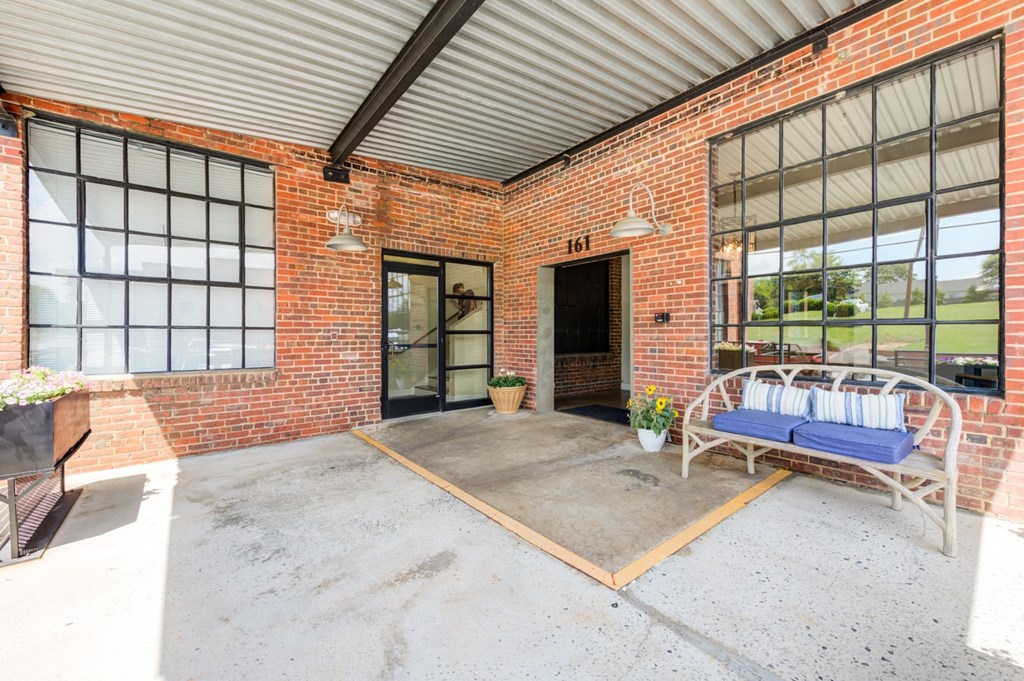A patio area with a bench.