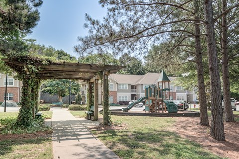 Play ground with slides and wooden pergola at Brooke Pointe Apartments, Concord, NC, 28027