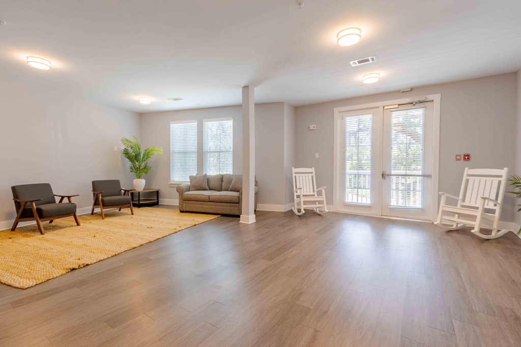 A spacious living room with wooden floors and furniture. at Bulls Creek, Charleston, South Carolina