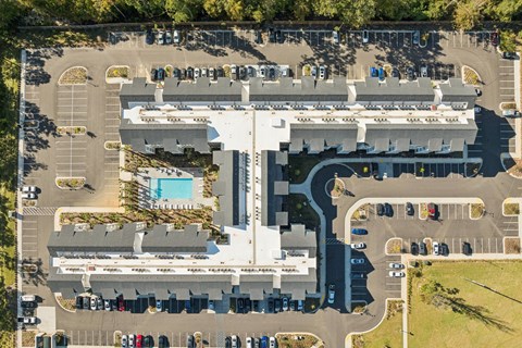 A large building with a pool in the middle of it.