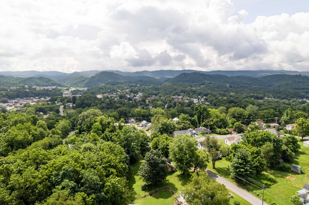A small town nestled in a valley surrounded by mountains.