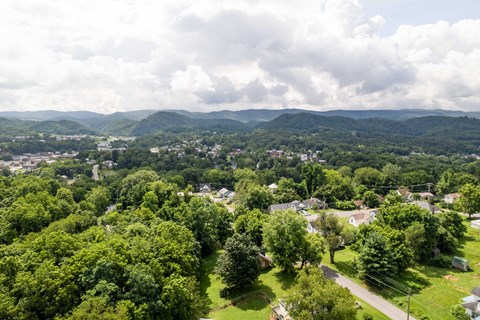 A small town nestled in a valley surrounded by mountains.