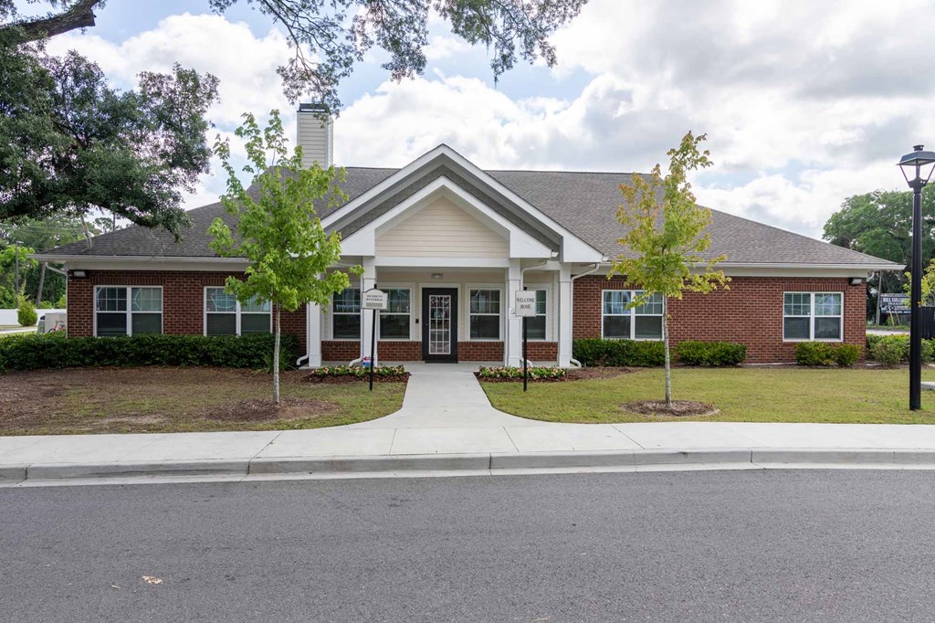 A building with a brick facade and a white roof.