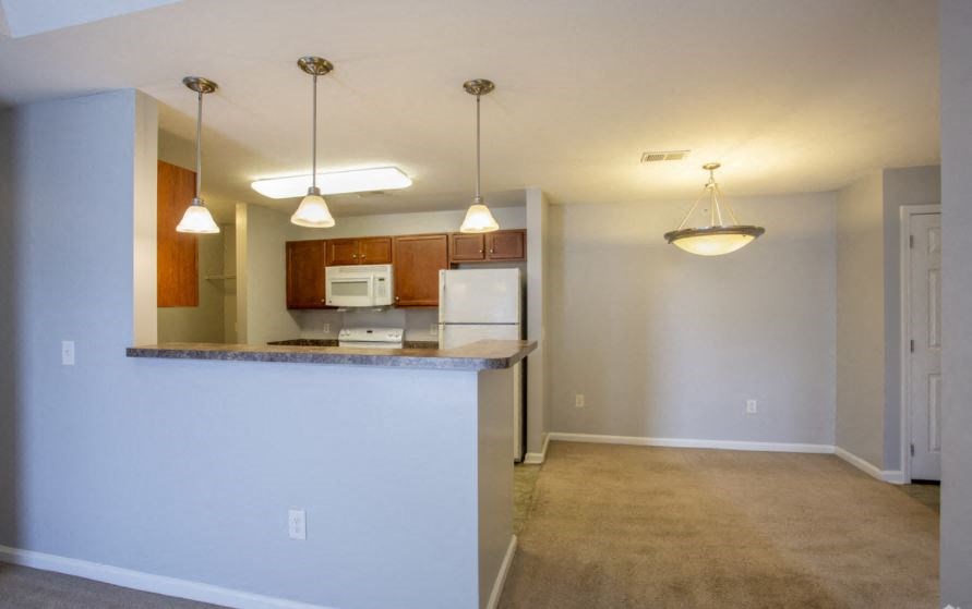 Kitchen and Separate Dining Room at The Parker at Cone Apartments, Greenville, NC