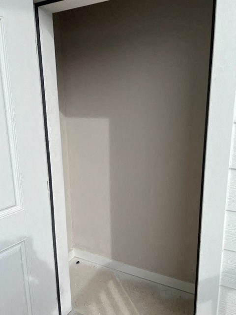 a doorway into a room with a white door
