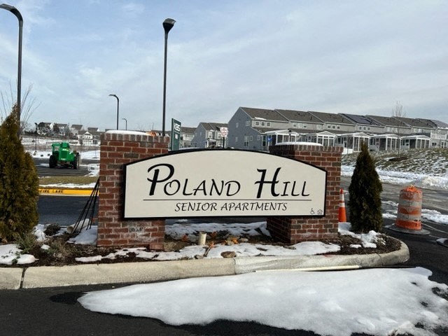 a sign serviced apartments in front of a building