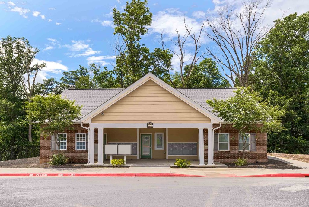 A small building with a porch and a covered entrance at Robinson Park Apartments, Harrisonburg 22801