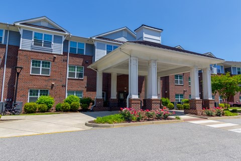 A building with a covered walkway entrance.