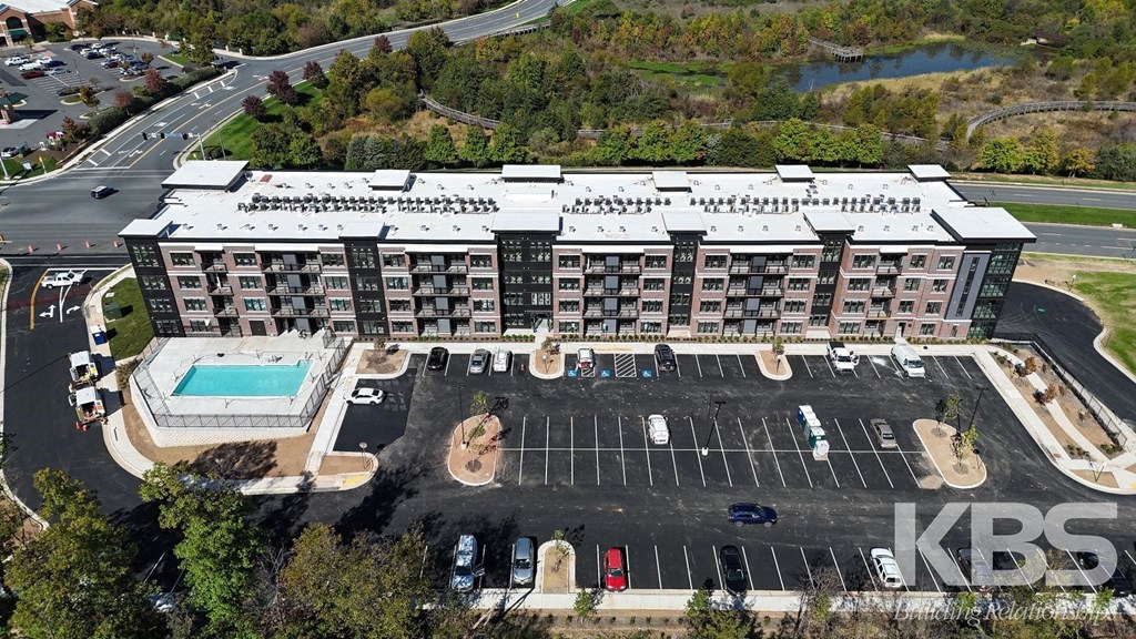 an aerial view of the kbs condominiums and parking lot