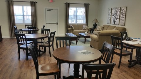 a living room with tables and chairs and a couch
