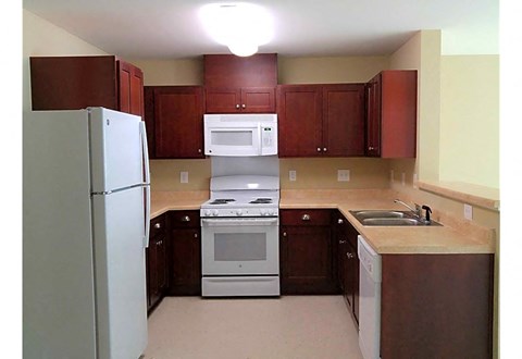 a kitchen with a stove microwave and refrigerator