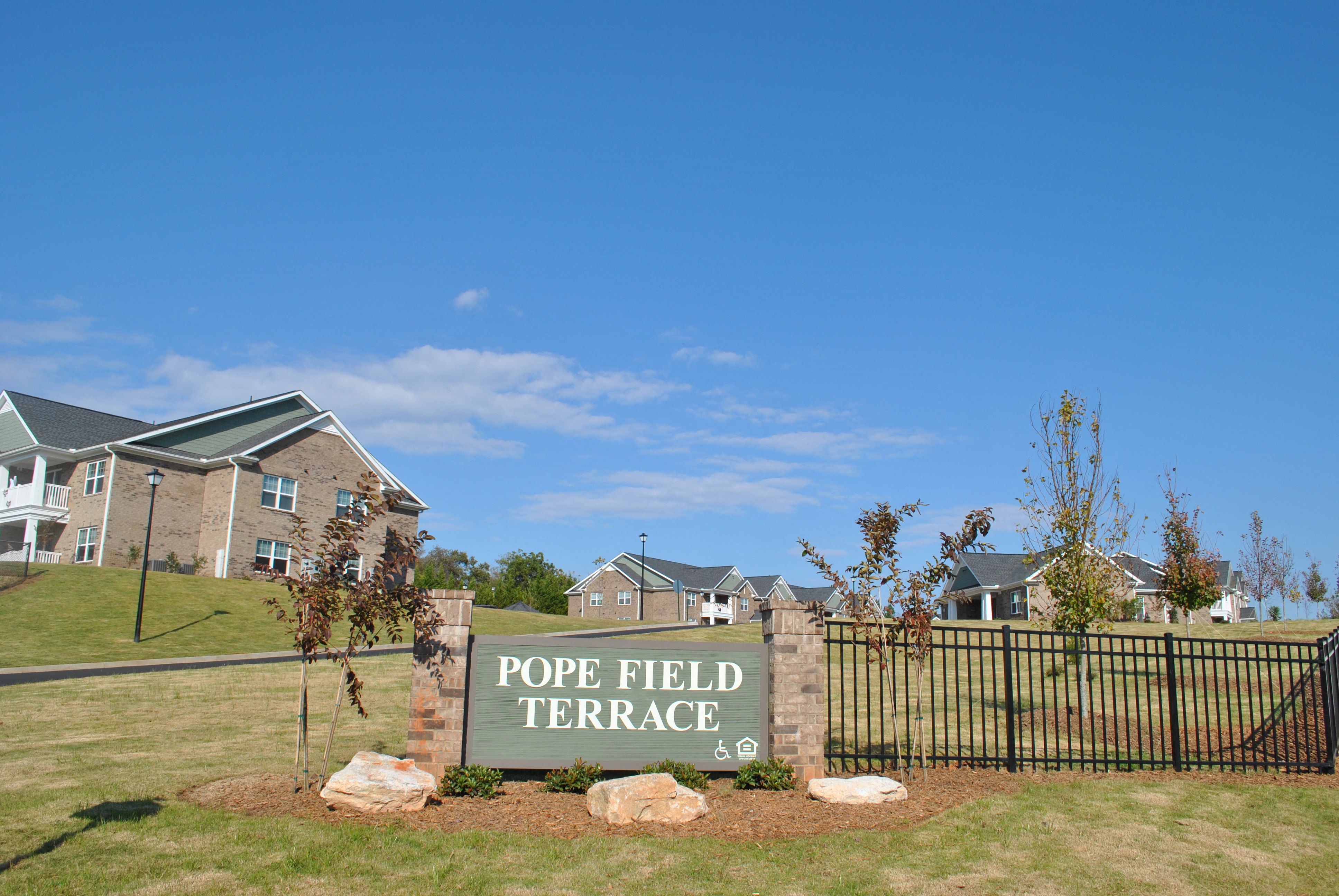 a sign that reads poe field terrace in front of houses