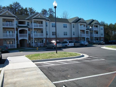 an apartment building on the corner of a city street