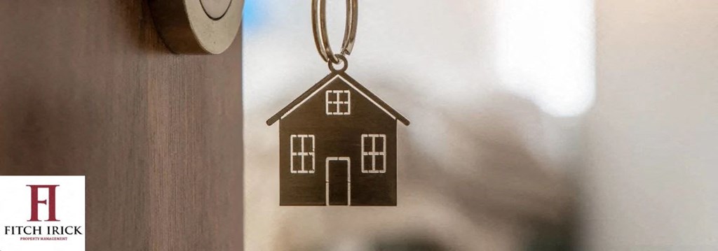 A house keychain hanging from a wooden door. at Coit Village Apartments, Florence, SC, 29501